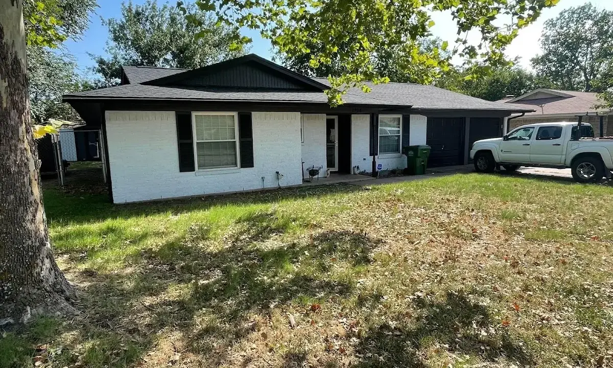Professional roofing crew working on a residential roof in Camas